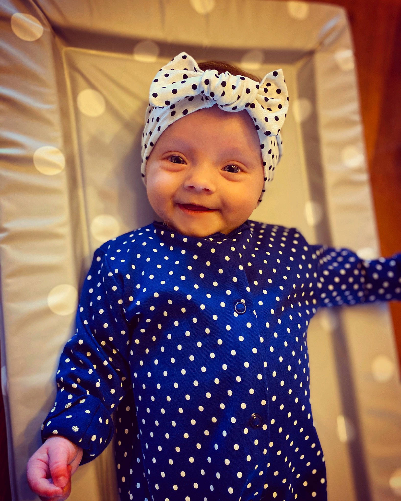 Dottie is registered to the contest to win money with this photo: baby, blue, child, clothing, design, dress, ear, electric_blue, happy, headgear, headwear, joy, outerwear, pattern, person, polka_dot, sleeve, smile, toddler