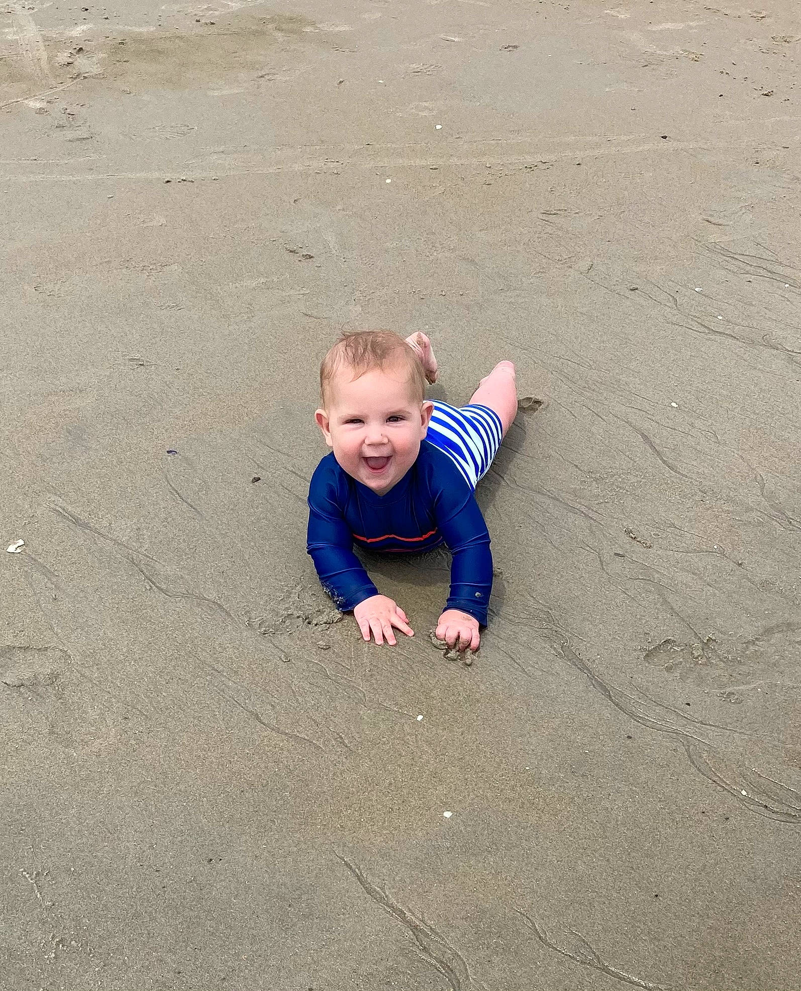 Henry joined the competition — help win amazing prizes! asphalt, baby, baby_toddler_clothing, beach, flooring, fun, grass, happy, head, landscape, leisure, people_in_nature, person, play, road_surface, sand, sitting, smile, soil, toddler