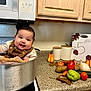Keila joined the competition — help win amazing prizes! autumn_leaves, baby, cabinet, carrot, child, cloth, coffee_maker, countertop, cucumber, cute, kitchen, microwave, milestone_sign, onion, pot, potato, smiling, stove, tomato, vegetables