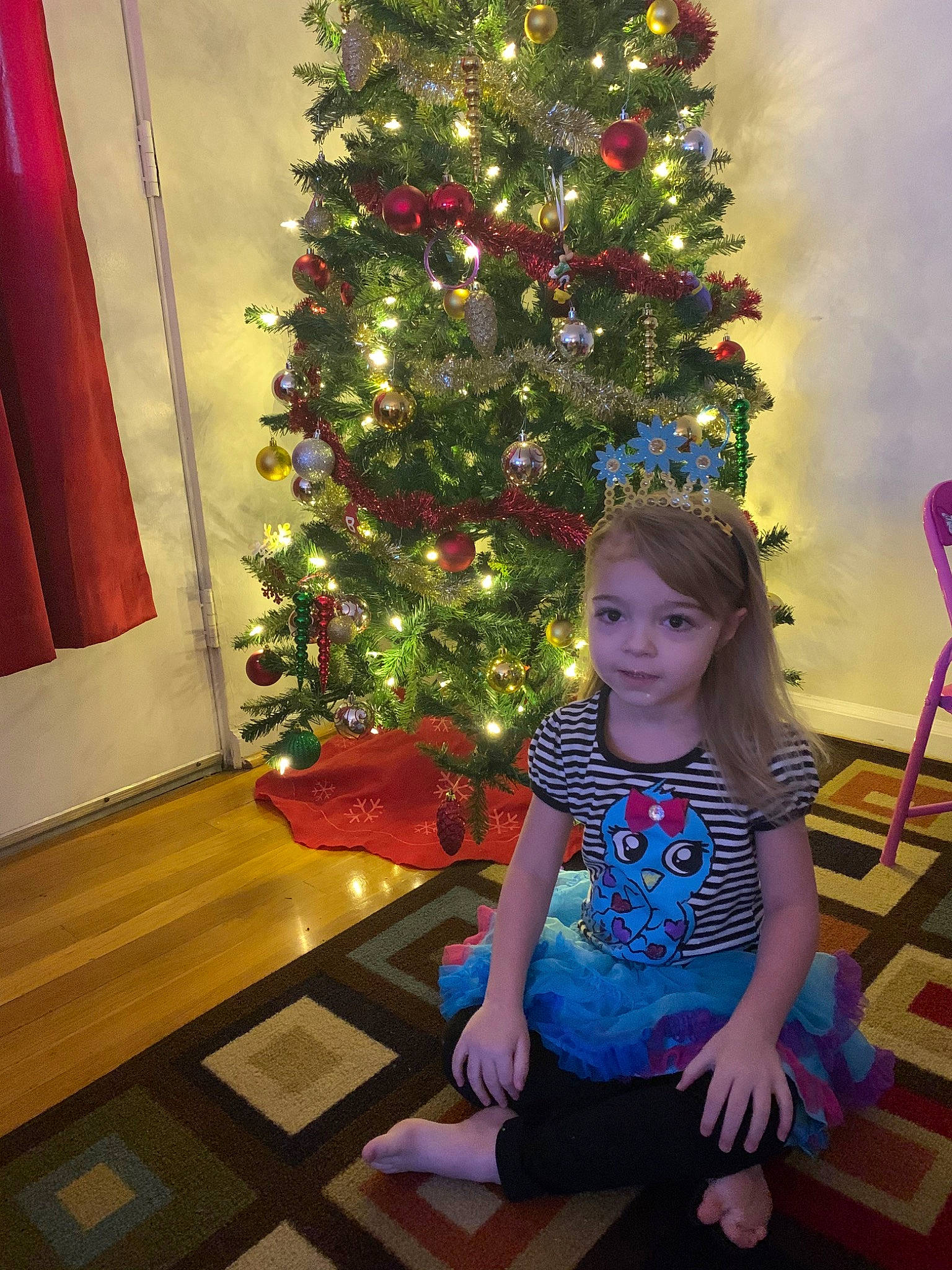Maci Marie joined the competition — help win amazing prizes! child, christmas, christmas_decoration, christmas_eve, christmas_ornament, christmas_tree, conifer, event, fir, holiday, home, interior_design, person, pine_family, plant, room, sitting, standing, toddler, tree