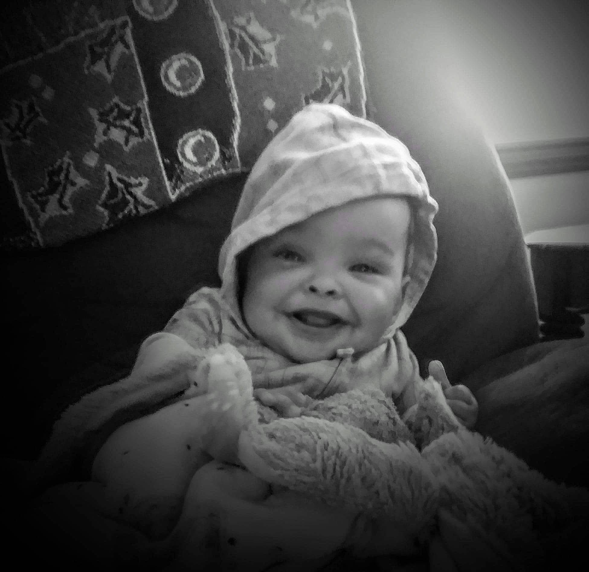 Jaylee joined the competition — help win amazing prizes! baby, black_and_white, cap, child, cloud, comfort, face, flash_photography, fun, happy, headwear, joy, linens, monochrome, monochrome_photography, person, room, sitting, sky, sleeve