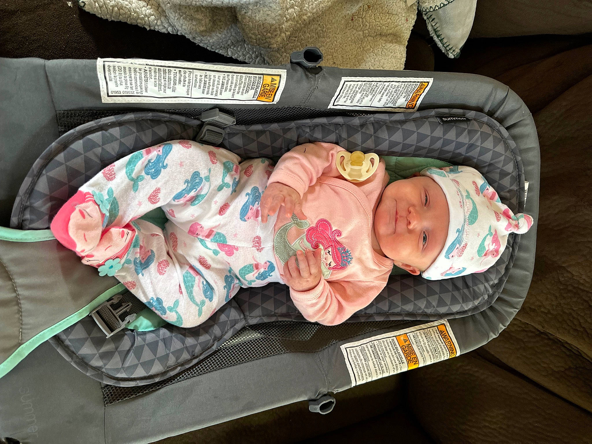 Ashtyn joined the competition — help win amazing prizes! baby, baby_carriage, baby_products, baby_safety, baby_sleeping, baby_toddler_clothing, child, comfort, headwear, infant_bed, lap, linens, nap, pattern, person, sitting, sleep, textile, toddler