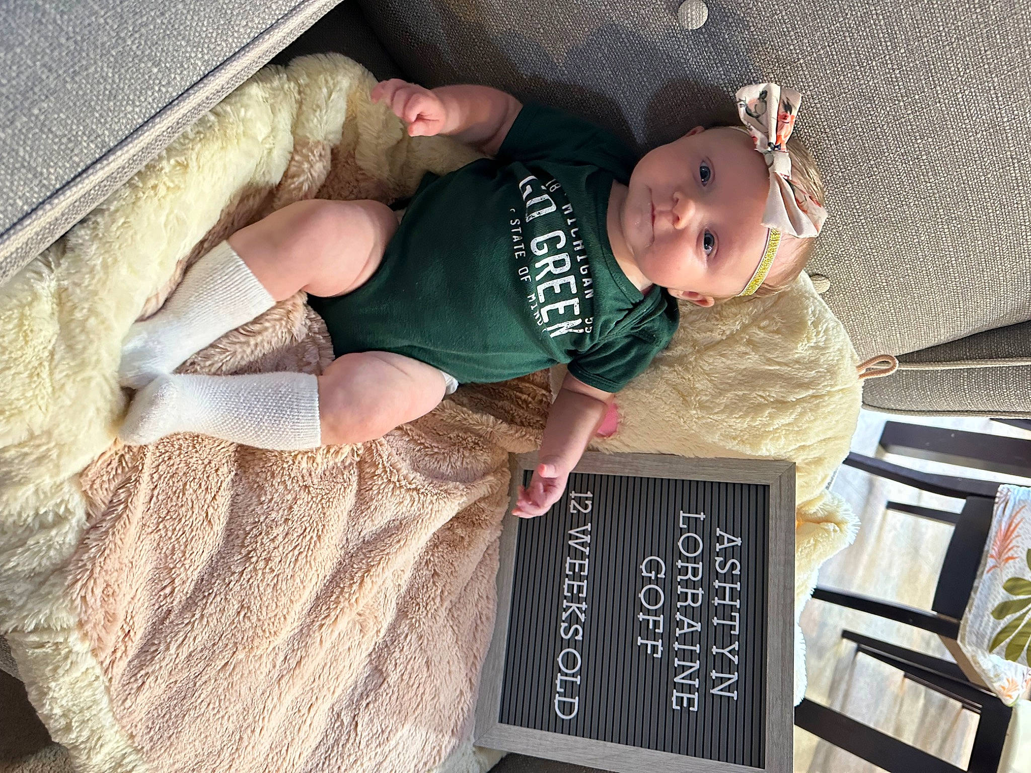 Ashtyn is registered to the contest to win money with this photo: baby, baby_products, baby_toddler_clothing, blackboard, chalk, child, comfort, denim, font, foot, gesture, happy, hat, human_leg, person, sitting, slate, sleeve, t_shirt, toddler