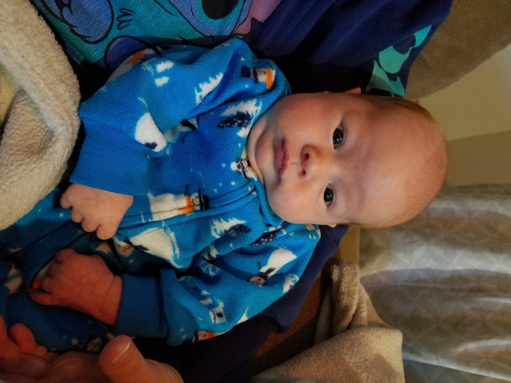 Flynn is registered to the contest to win money with this photo: baby, blue, cheek, child, eye, head, iris, mouth, nose, person, skin, smile, toddler, vacation