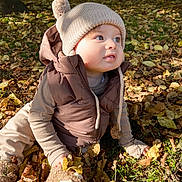 Thomas joined the competition — help win amazing prizes! toddler, child, autumn, leaves, park, outdoor, knitted_hat, pom_pom, vest, curious, grass, sunlight, soft_slipper, fall, nature, baby, cute, seasonal, exploring, clothing