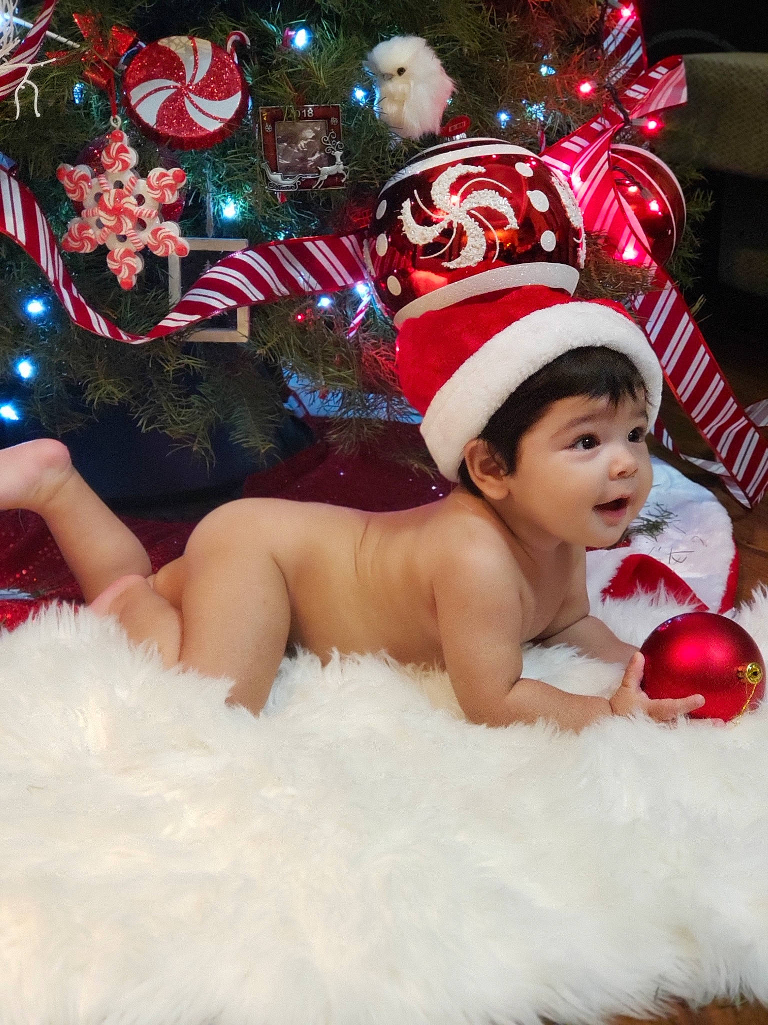 Gustavo joined the competition — help win amazing prizes! baby, child, christmas, christmas_decoration, christmas_eve, christmas_ornament, christmas_tree, costume_accessory, fictional_character, headwear, holiday, interior_design, person, toddler