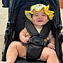 Ayla joined the competition — help win amazing prizes! baby, stroller, smiling, hat, sunhat, child, outdoor, poolside, black_stroller, happy, infant, sitting, summer, cute, baby_clothing, safety_harness, foot, hand, daylight, bracelet