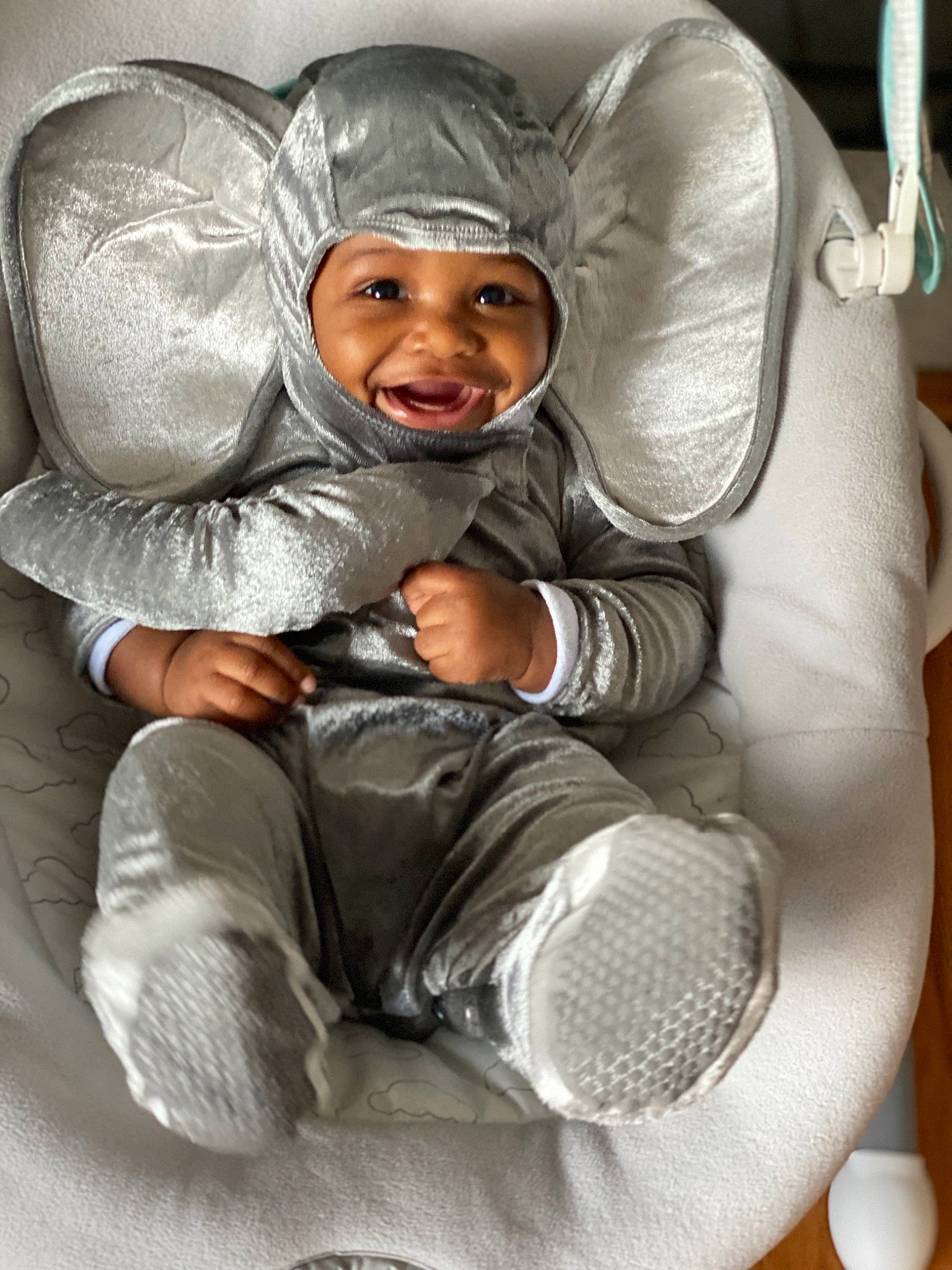 Makai is registered to the contest to win money with this photo: baby, baby_products, baby_toddler_clothing, child, comfort, glove, headwear, hood, joy, nose, person, sweatshirt