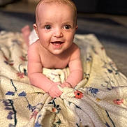 Sienna joined the competition — help win amazing prizes! baby, blanket, child, smiling, happy, face, infant, skin, hands, floor, indoors, portrait, cute, young, expression, eyes, head, toddler, clothing, soft