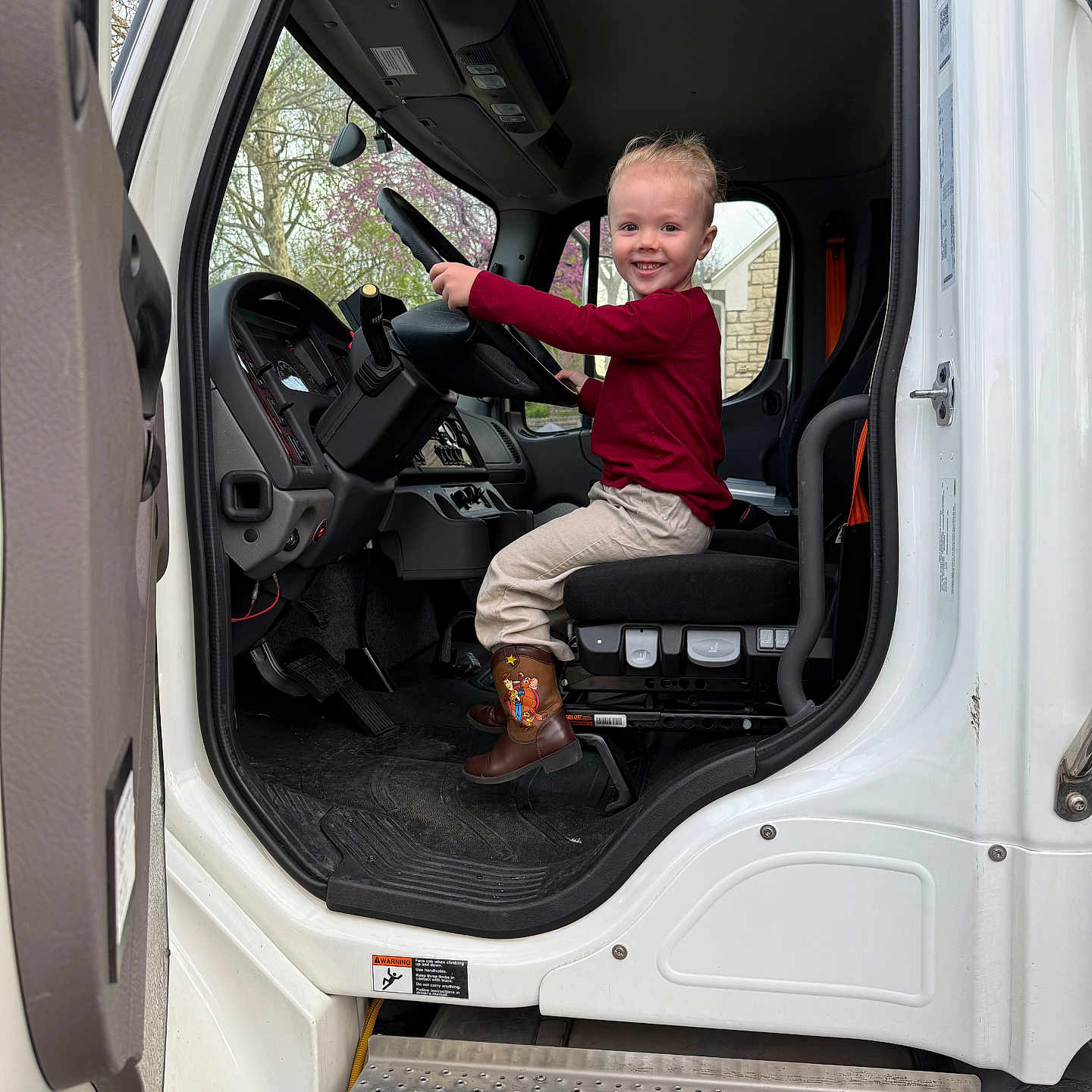 Phelan is registered to the contest to win money with this photo: boy, car, cartrunk, child, clothing, cushion, face, footwear, head, homedecor, machine, male, person, photography, portrait, shoe, sitting, transportation, vehicle, wheel