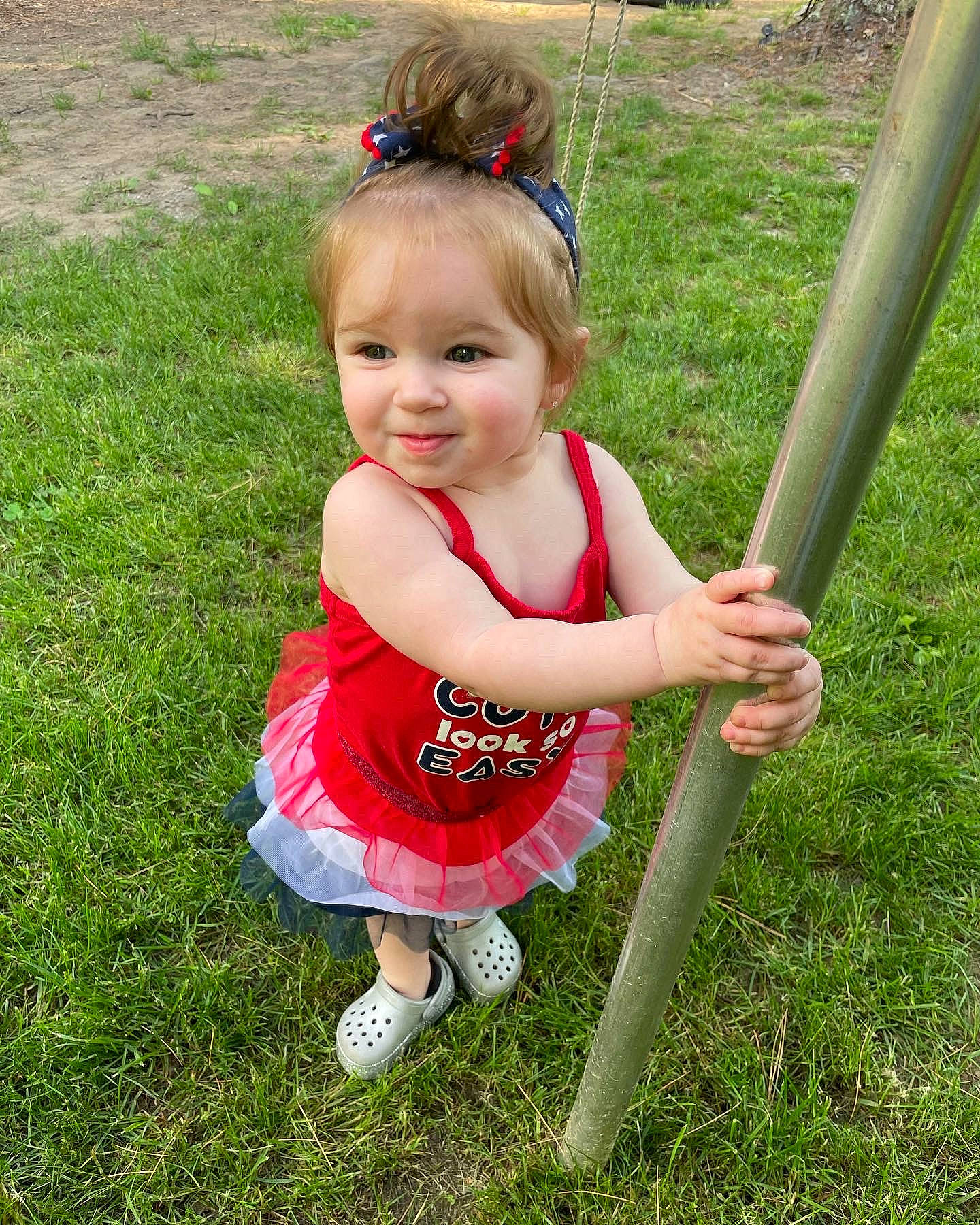 Angelina joined the competition — help win amazing prizes! baby_toddler_clothing, child, fun, grass, grassland, happy, joy, lawn, leisure, people_in_nature, person, plant, play, pole, recreation, sandal, shorts, smile, spring, toddler