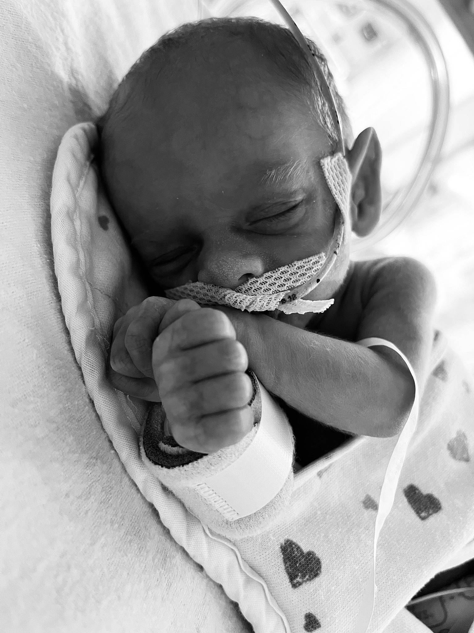 Eli joined the competition — help win amazing prizes! arm, baby, baby_sleeping, baby_toddler_clothing, black_and_white, child, comfort, ear, finger, gesture, hand, happy, human_body, monochrome, monochrome_photography, mouth, person, skin, sleeve, style