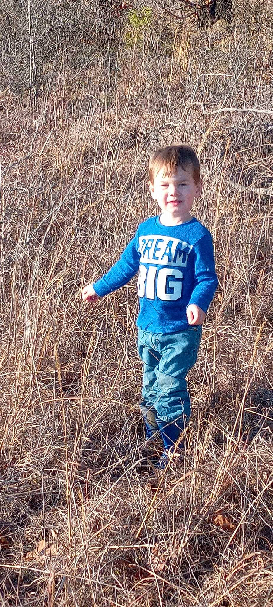 Easton joined the competition — help win amazing prizes! baby, baby_toddler_clothing, child, electric_blue, face, field, fun, grass, grassland, happy, landscape, outerwear, people_in_nature, person, prairie, smile, soil, t_shirt, toddler, winter