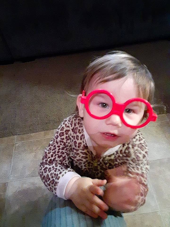 Aaliyah joined the competition — help win amazing prizes! audio_equipment, baby_toddler_clothing, cheek, ear, eyelash, eyewear, flooring, fun, fur, happy, head, iris, nose, person, personal_protective_equipment, sitting, skin, sleeve, smile, toddler