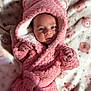 baby, bear_ears, blanket, child, cozy, cute, expression, face, hooded_clothing, indoor, infant, newborn, pink_robe, portrait, resting, sleeping_area, small_hands, soft_fabric, soft_texture, warm_clothing
