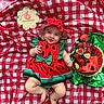 Treazure joined the competition — help win amazing prizes! baby, infant, smiling, watermelon_outfit, hat, red_and_white_checkered_blanket, wooden_sign, 6_months, cake, fruit, strawberries, blueberries, lime, green_wrapping, outdoor, grass, celebration, cute, person, portrait
