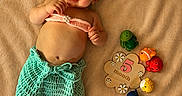 Treazure joined the competition — help win amazing prizes! baby, mermaid_costume, smiling, toy, plaque, 5_month, blanket, crochet, headband, cute, infant, lying_down, colorful, playful, happy, child, portrait, soft_texture, indoors, celebration
