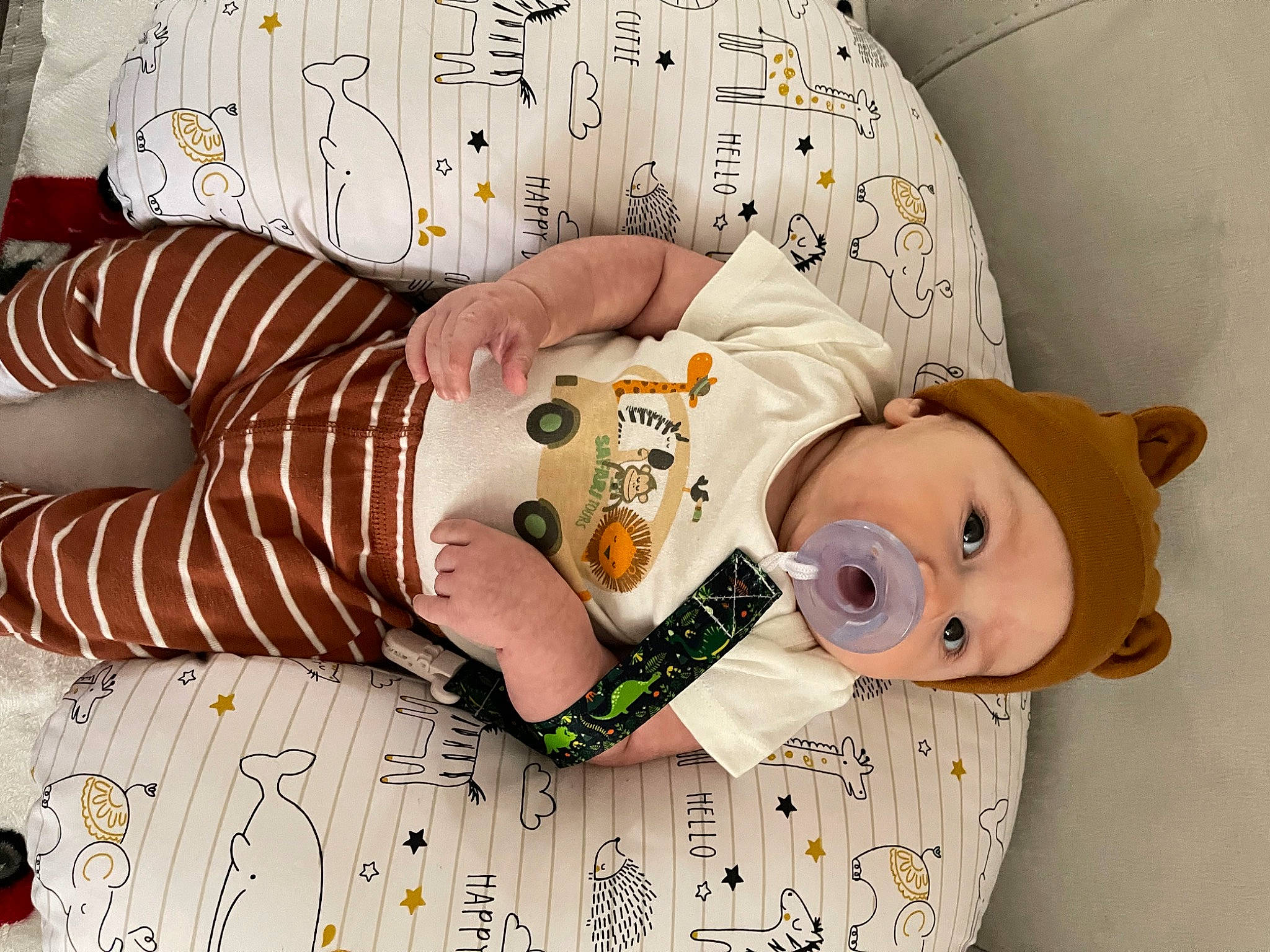 Brooks is registered to the contest to win money with this photo: arm, baby, baby_products, baby_sleeping, baby_toddler_clothing, child, comfort, finger, hand, happy, headwear, linens, nail, pattern, peach, person, sleeve, stuffed_toy, thigh, toy