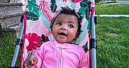 Wynterr joined the competition — help win amazing prizes! baby, child, stroller, pink_clothing, curly_hair, smiling, outdoor, grass, house, headband, toddler, portrait, happy, person, seat, daylight, nature, colorful, cute, expression