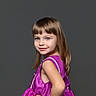 child, girl, portrait, dress, magenta, smile, posing, studio, background, happy, young, cute, fashion, person, human, hair, confident, sleeveless, elegant, childhood