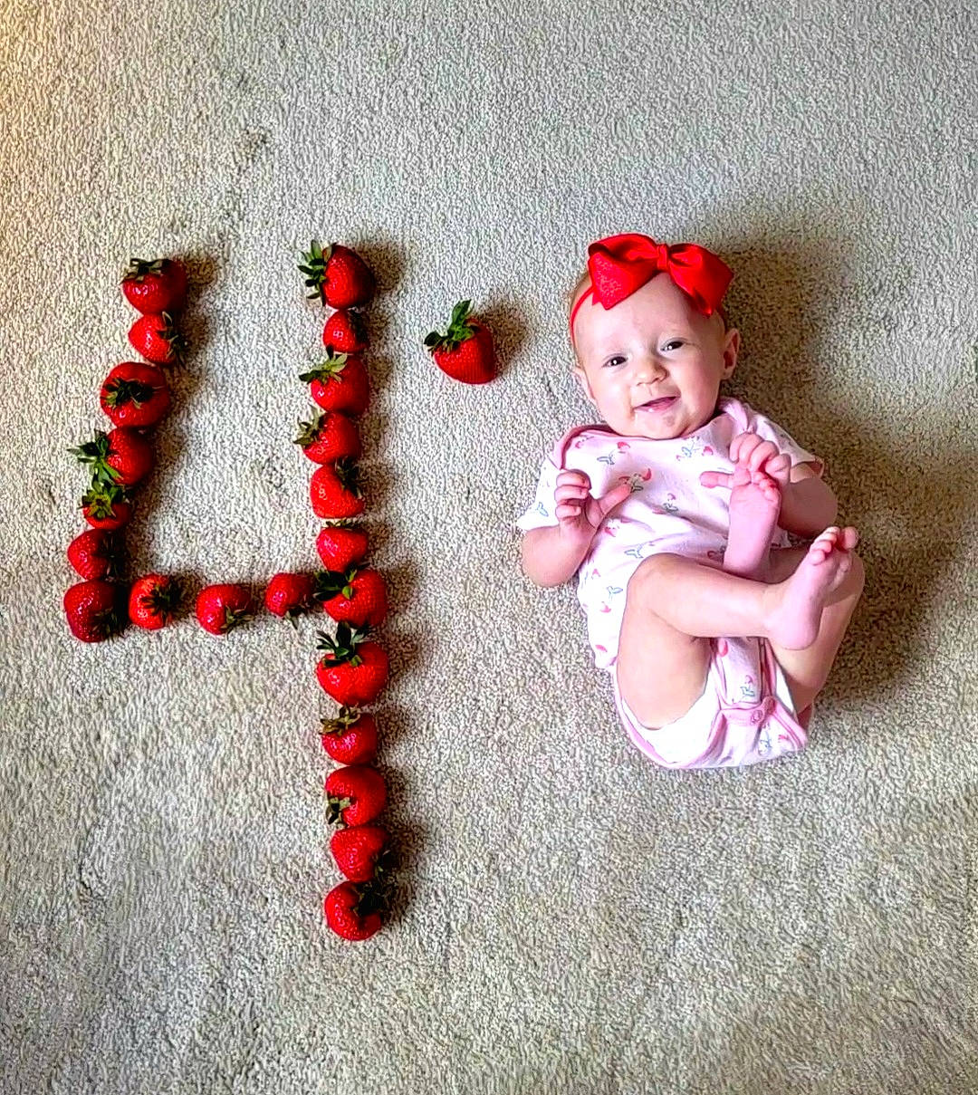 Kinsley is registered to the contest to win money with this photo: baby, baby_toddler_clothing, cap, carmine, clothing, costume_hat, facial_expression, fashion_accessory, flooring, foot, happy, headgear, headwear, holiday, human_body, pattern, person, plant, product, sleeve