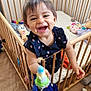 Juliana a rejoint le concours — aidez-le/la à gagner de superbes lots ! toddler, crib, toy, smiling, child, indoor, wooden_crib, blanket, plush_toys, floor, clothing, happy, person, baby, room, furniture, head, hand, footwear, portrait