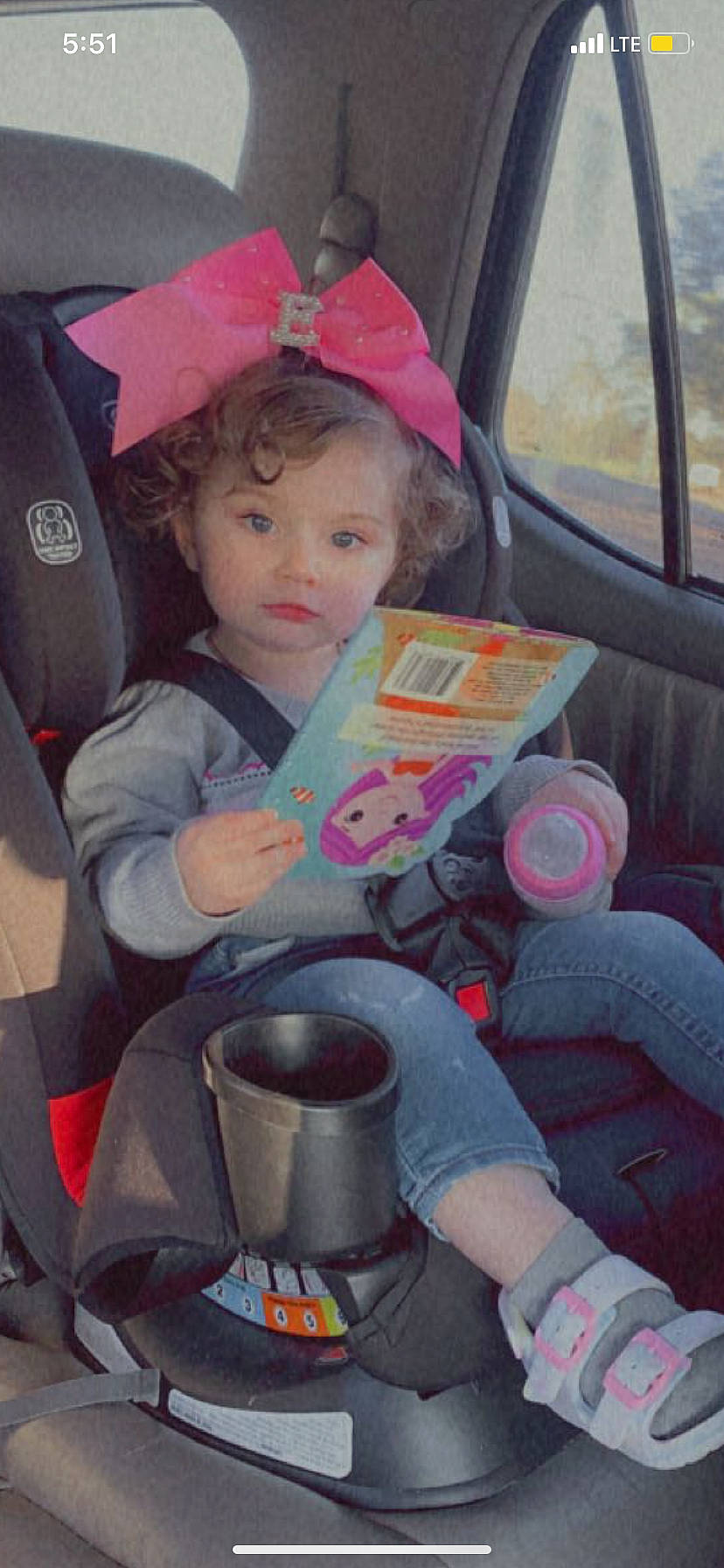 Evangeline is registered to the contest to win money with this photo: auto_part, baby_carriage, car, car_seat, car_seat_cover, child, cool, fun, hand, lap, leisure, motor_vehicle, person, pink, sitting, steering_wheel, toddler, tree, vehicle, vehicle_door