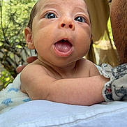 Xavien is registered to the contest to win money with this photo: architecture, baby, bodypart, building, face, grass, happy, head, laughing, mouth, newborn, outdoors, person, photography, plant, portrait, quilt, shelter, tree, vegetation