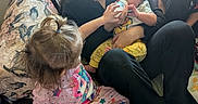 Ezekiel is registered to the contest to win money with this photo: baby, blanket, bottle, care, child, clothing, couch, family, feeding, floor, hair, home, indoors, love, pajamas, person, sitting, toddler, window, woman