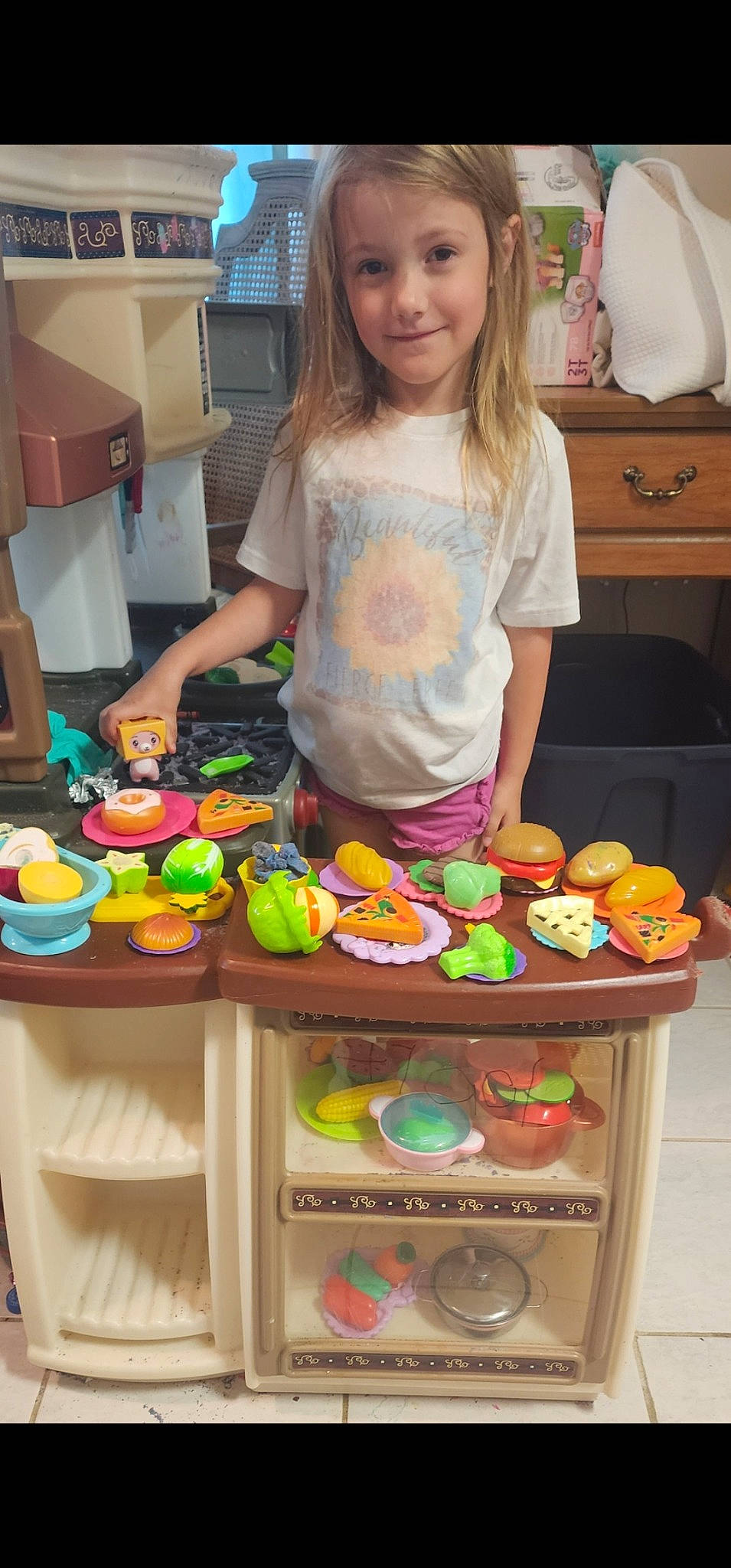Paislee joined the competition — help win amazing prizes! baked_goods, baking, cabinetry, chair, child, confectionery, cuisine, dessert, finger_food, food, food_group, joy, natural_foods, person, recipe, room, smile, sweetness, t_shirt, table