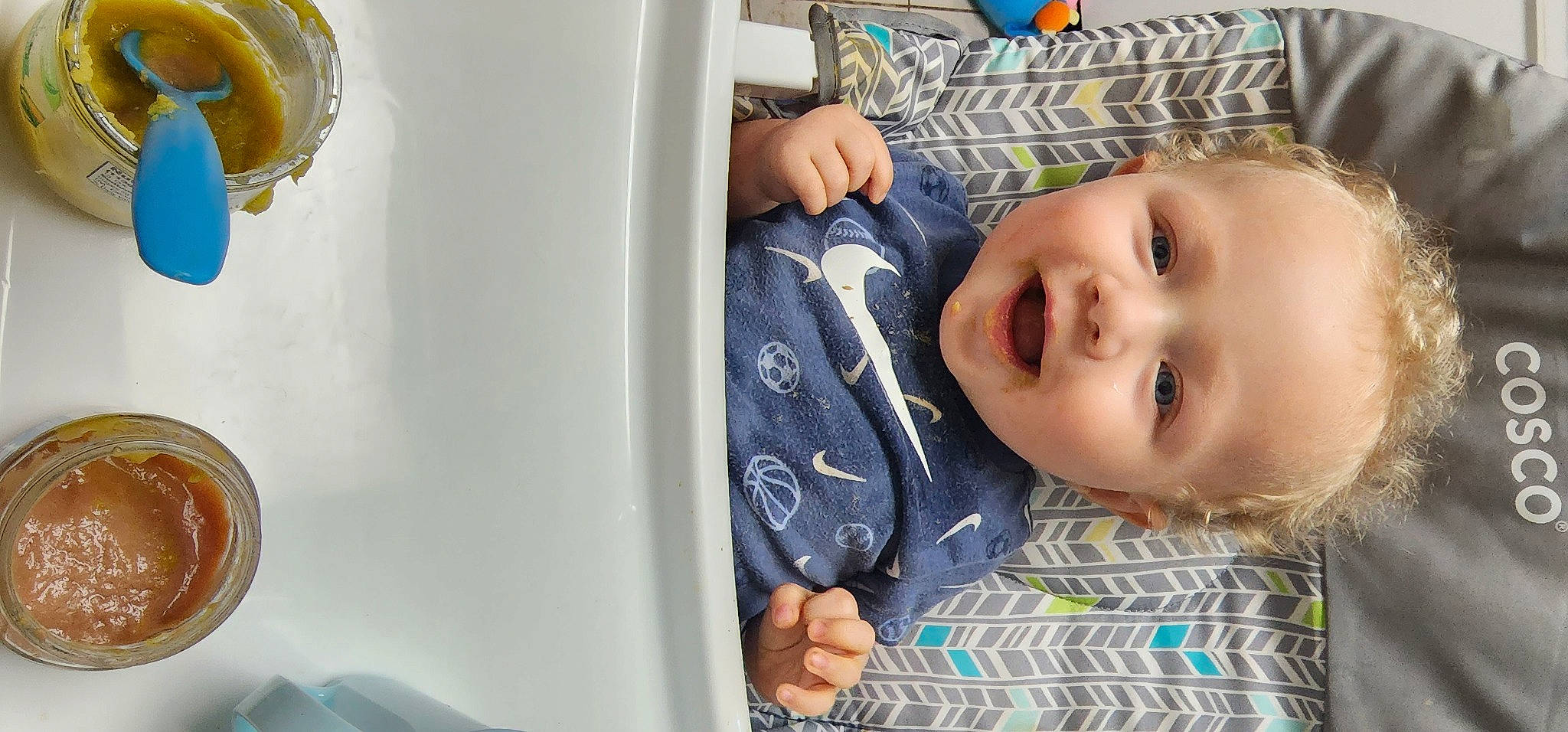 Jack is registered to the contest to win money with this photo: baby, baby_laughing, baby_toddler_clothing, cheek, child, comfort, dishware, eyebrow, gesture, happy, linens, nose, pattern, person, plate, room, skin, sleeve, smile, toddler