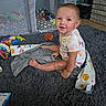 Lyra joined the competition — help win amazing prizes! baby, child, sitting, smiling, portrait, indoors, playroom, rug, blanket, toys, playpen, mirror, ball, bodysuit, barefoot, infant, happy, home, floor, cozy