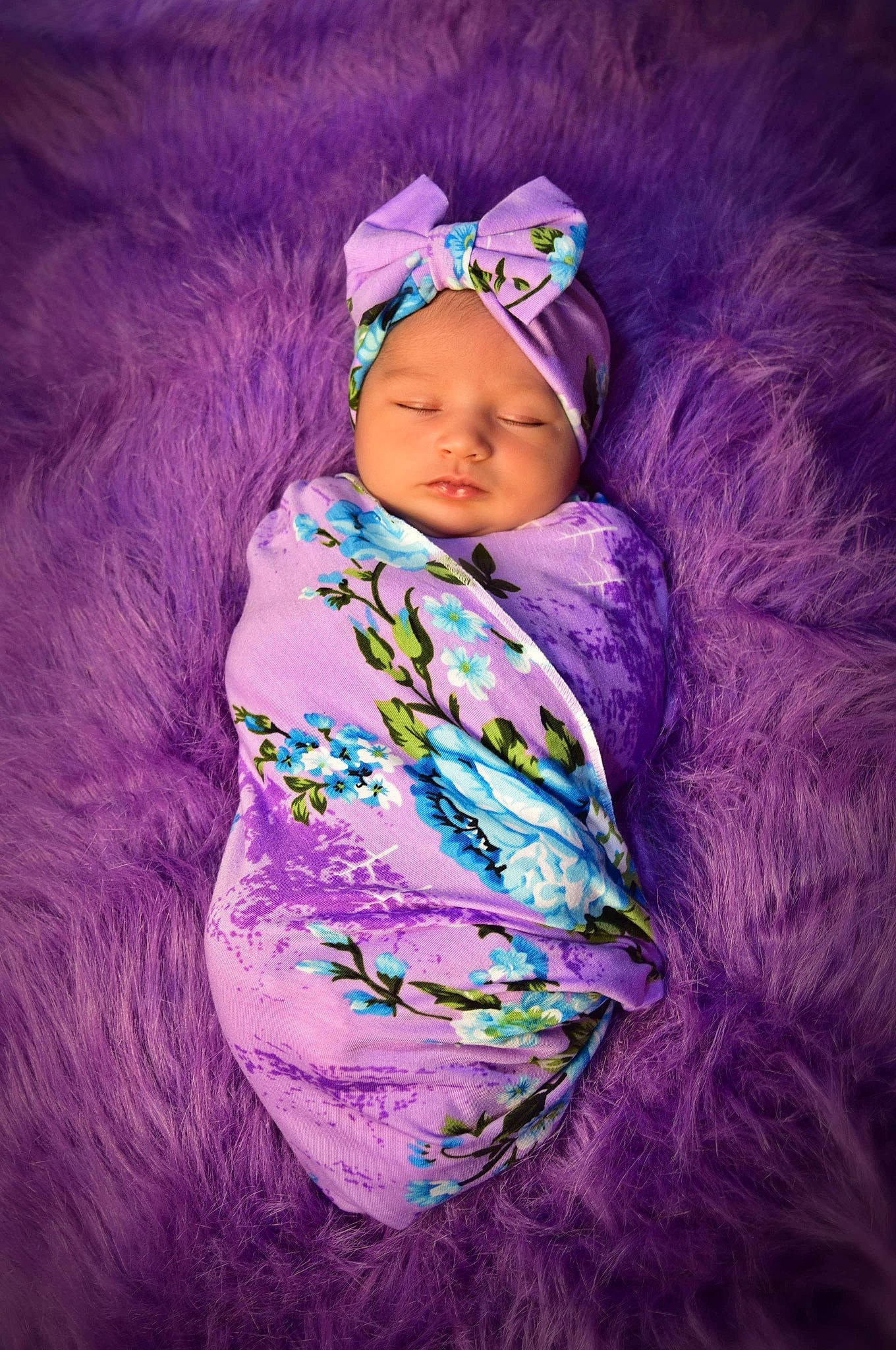 Lailani is registered to the contest to win money with this photo: baby, baby_toddler_clothing, cap, child, electric_blue, fashion_accessory, flash_photography, grass, happy, headwear, human_body, knit_cap, linens, lip, magenta, person, pink, purple, skin, textile