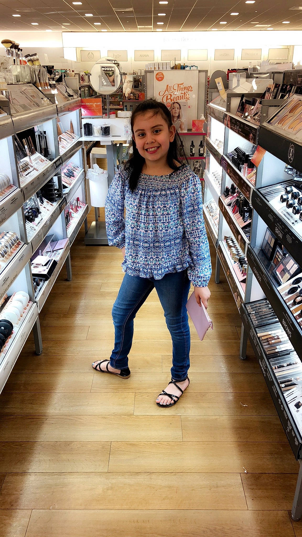 Nailea is registered to the contest to win money with this photo: building, child, child_model, clothing, collection, denim, fashion, footwear, fun, jeans, joy, outerwear, person, retail, shelf, shoe, shopping, snapshot, sportswear, supermarket