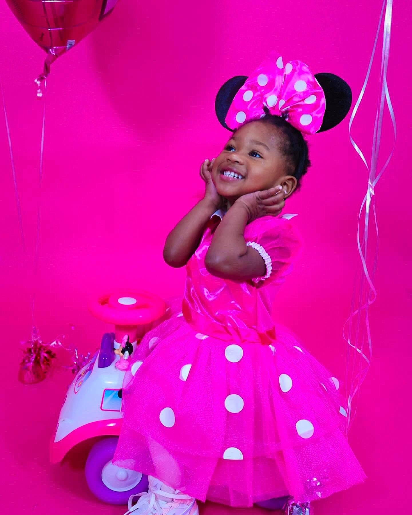 Majesty is registered to the contest to win money with this photo: baby_toddler_clothing, child, dress, entertainment, event, fashion_design, flash_photography, fun, happy, hat, joy, magenta, pattern, person, pink, purple, skin, sleeve, smile, sun_hat