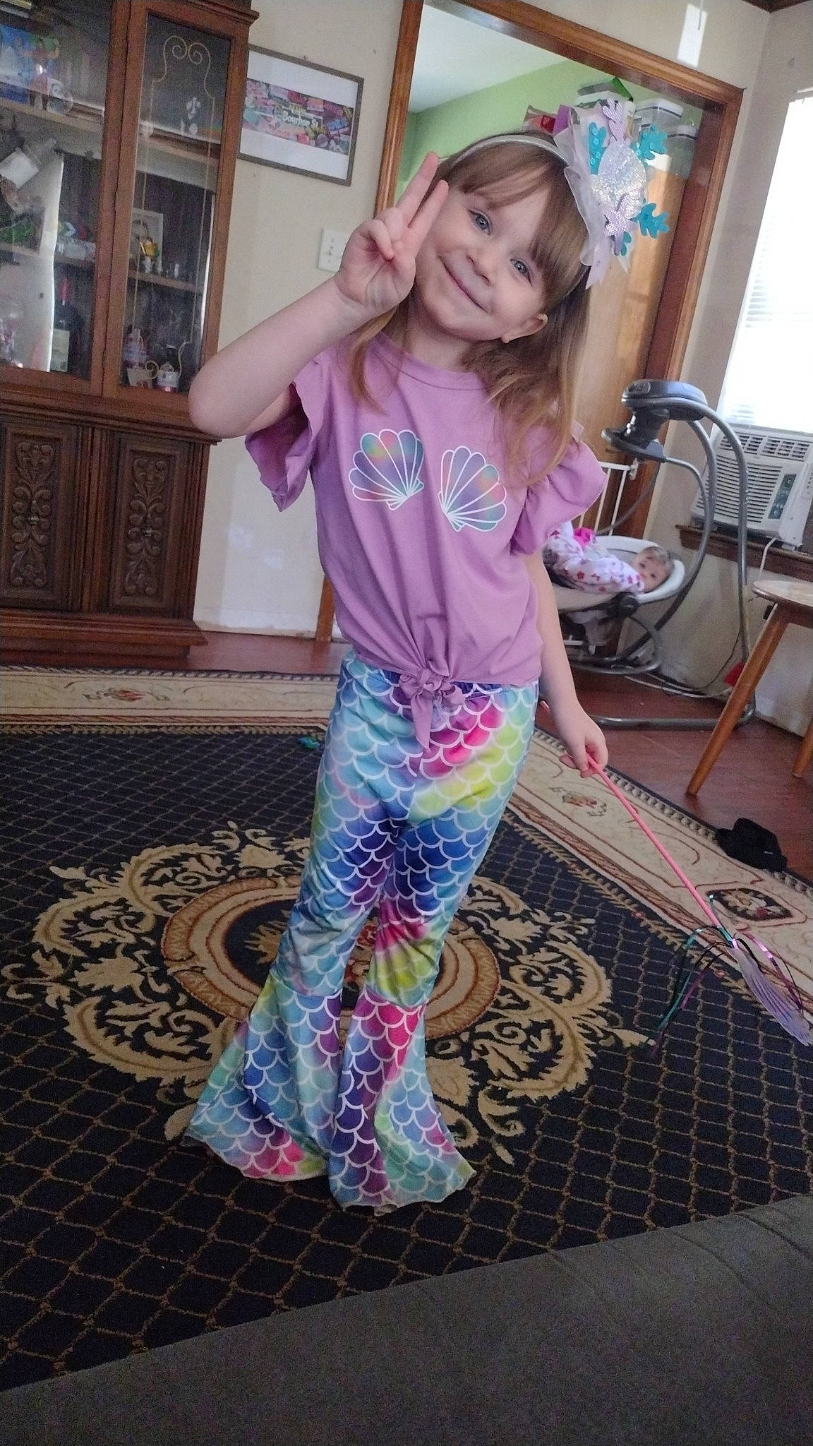 Stella joined the competition — help win amazing prizes! chair, fashion_design, floor, flooring, fun, happy, hardwood, human_leg, joy, magenta, pajamas, pattern, person, purple, sleeve, smile, t_shirt, thigh, toddler, visual_arts