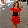 child, girl, dress, red, black, flamenco, street, sidewalk, tree, car, shoes, smile, sunlight, building, urban, daytime, person, long_hair, fashion, outdoor