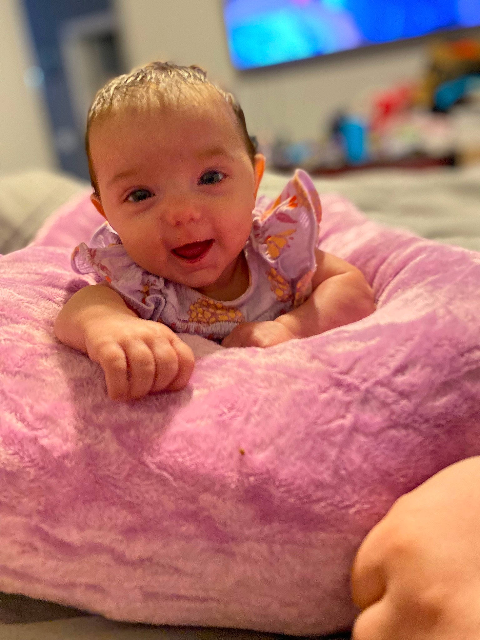 Lakelee is registered to the contest to win money with this photo: baby, baby_toddler_clothing, cheek, comfort, eyebrow, finger, flooring, fun, hair, happy, head, leisure, mouth, muscle, nose, person, pink, skin, smile, television