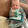Louis participe au concours pour gagner de l'argent avec cette photo : baby, blanket, chair, child, clothing, comfort, cozy, curious, cushion, cute, fabric_book, home, indoor, infant, person, plush_toy, portrait, reading, sitting, soft_toy