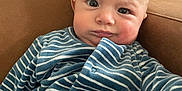 Louis a rejoint le concours — aidez-le/la à gagner de superbes lots ! baby, infant, child, striped_clothing, blue_clothing, onesie, face, expression, chair, indoor, furniture, person, cute, portrait, skin, head, eyes, mouth, sitting, casual