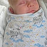 Liam is registered to the contest to win money with this photo: baby, sleeping, swaddled, blanket, infant, cozy, cute, face, peaceful, soft, white, pattern, owl, castle, stars, clouds, newborn, child, resting, portrait