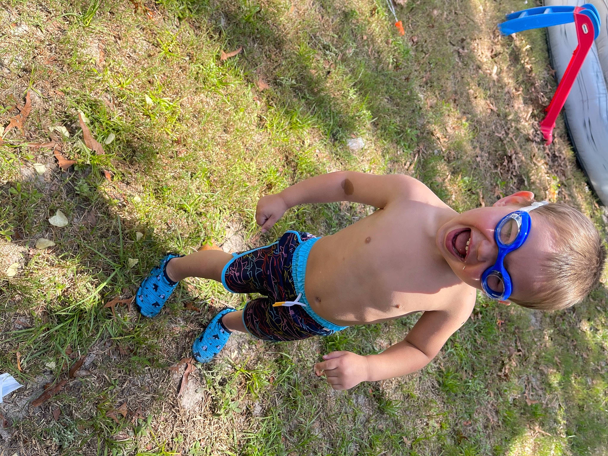Trey joined the competition — help win amazing prizes! barechested, barefoot, electric_blue, fun, grass, grass_family, grassland, human_leg, lawn, leisure, people_in_nature, person, plant, recreation, shorts, smile, soil, swimwear, thigh, toddler