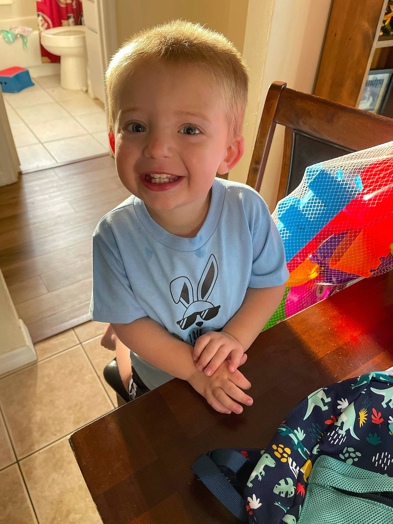Kalvin joined the competition — help win amazing prizes! baby_toddler_clothing, child, flooring, fun, happy, hardwood, home, joy, lap, pattern, person, plaid, play, room, sitting, sleeve, smile, t_shirt, tartan, toddler