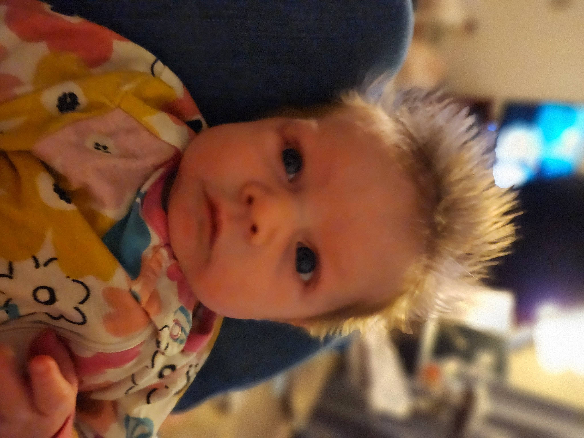 Addy is registered to the contest to win money with this photo: baby, cheek, child, chin, eye, eyebrow, eyelash, forehead, fun, fur, happy, hat, iris, lip, mouth, nose, person, room, skin, toddler