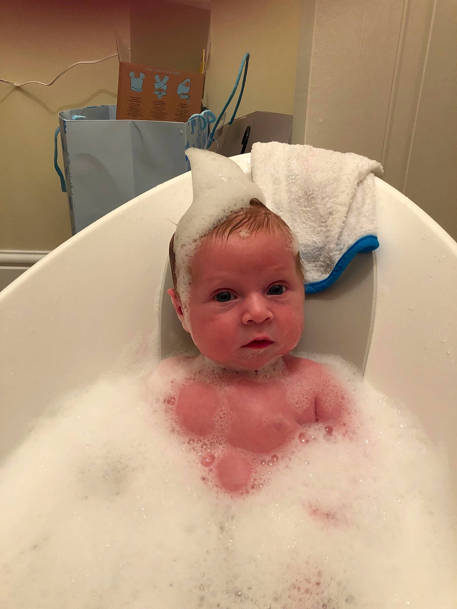 Bertie is registered to the contest to win money with this photo: baby, baby_bathing, bathing, bathtub, child, foam, person, room, skin, washing