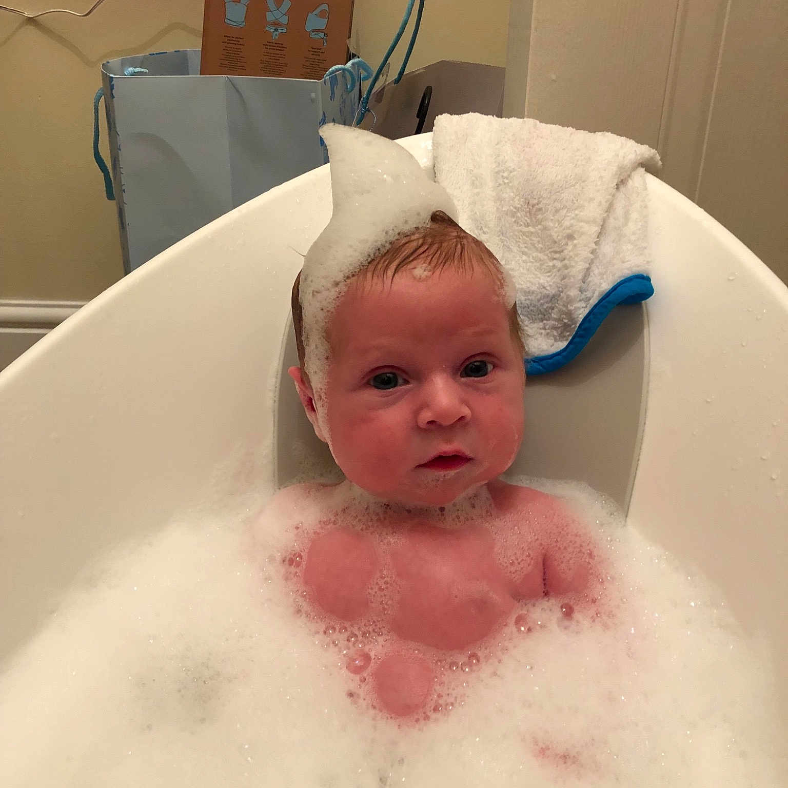 Bertie is registered to the contest to win money with this photo: baby, baby_bathing, bathing, bathtub, child, foam, person, room, skin, washing