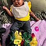 Ava-Rae joined the competition — help win amazing prizes! baby, blanket, clothing, couch, cushion, face, furniture, happy, head, homedecor, openingpresent, pants, person, photography, portrait, quilt, sitting, sleeve, smile