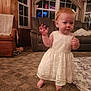 toddler, child, baby, dress, lace, barefoot, carpet, living_room, furniture, curtains, window, chair, sofa, indoor, person, cute, expression, hands, floor, home