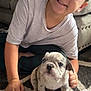 boy, puppy, dog, child, smiling, indoor, carpet, couch, toy, pet, cute, young, happy, sitting, animal, floor, home, casual, friendship, playful