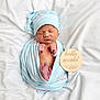 newborn, baby, infant, wrapped, blanket, hat, sleeping, peaceful, soft, cute, wooden_sign, hello_world, white_background, portrait, human, small, delicate, fresh, resting, newborn_photography